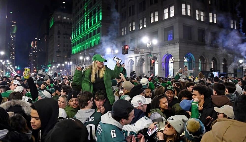 Alt text: Hundreds of Eagles fans crowd Broad Street to celebrate after the 2025 Super Bowl win.