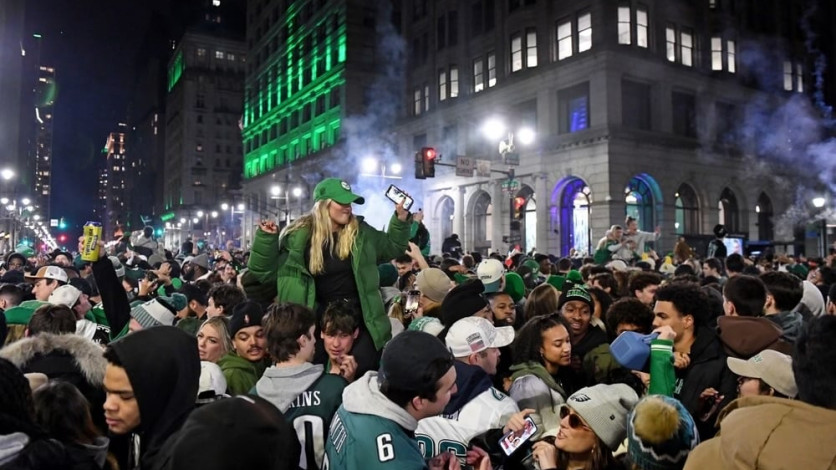Alt text: Hundreds of Eagles fans crowd Broad Street to celebrate after the 2025 Super Bowl win.