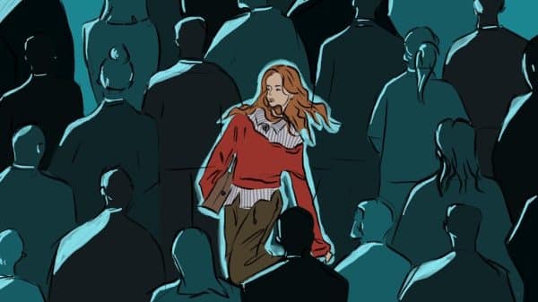 Women in a sea of people and she is the only one in colour while the crowd is deep shades of blue.